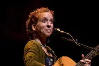 American singer-songwriter, guitarist, and activist Ani DiFranco performing at the Etown Concert, where she focused on a selection of political songs, demonstrating her unique blend of musical artistry and social commentary.