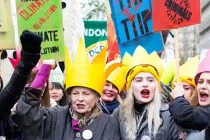 Designer Vivienne Westwood leads a crowd of over 50,000 activists through the streets of London, England, rallying for climate change action in anticipation of COP21 in Paris, France. The urgency of climate law reform is palpable as the mass of determined faces marches forward in solidarity. Photo by Matthew Kirby.