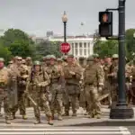 Special Forces soldiers from the Utah National Guard patrolling the streets during protests, sparking inquiries into the need for elite forces in largely nonviolent demonstrations and their impact on rights restrictions.