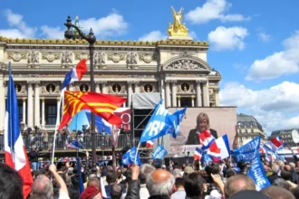 The image depicts a populist movement, with Le Pen often associated with right-wing populism in France.