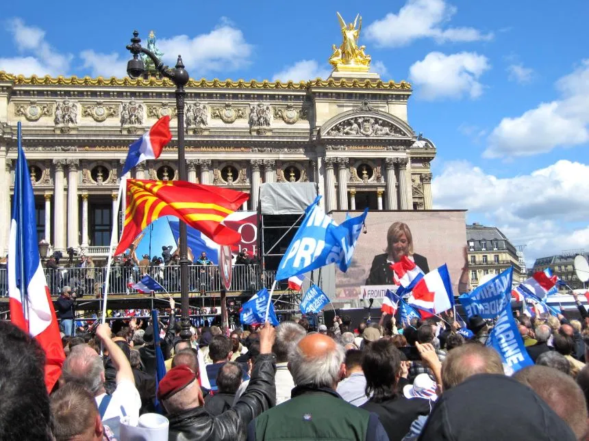 The image depicts a populist movement, with Le Pen often associated with right-wing populism in France.