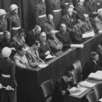 Perpetrators-This historic image captures a pivotal moment in the aftermath of World War II, where key figures accused of war crimes were brought to justice during the Nuremberg Trials. Held between 1945 and 1946, the trials marked a defining step toward accountability for atrocities committed, setting a precedent for international law and justice.