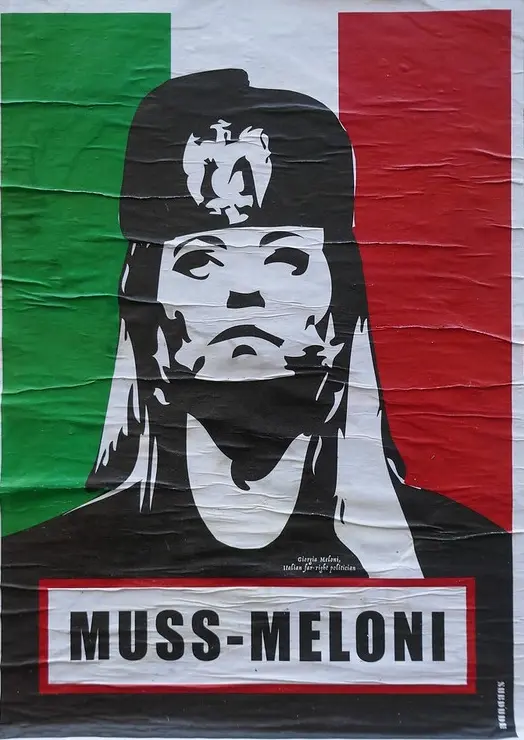 Street poster in Italy depicting Giorgia Meloni with controversial historical references to Benito Mussolini.