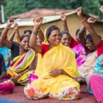 Empowered women in local governance forums, like this group in India, exemplify the transformative power of decentralization in fostering inclusive democracy and active community participation.