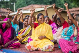 Empowered women in local governance forums, like this group in India, exemplify the transformative power of decentralization in fostering inclusive democracy and active community participation.