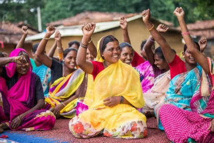 Empowered women in local governance forums, like this group in India, exemplify the transformative power of decentralization in fostering inclusive democracy and active community participation.