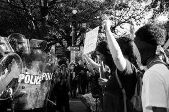 Disintegrating Societies: The Rise of Division and Unrest. As societies fracture under the weight of political polarization, economic disparity, and social unrest, the line between order and resistance blurs. This powerful image captures the escalating tensions between authority and protest, a reflection of the deepening societal divides shaping our world. Are we witnessing the fight for justice or the collapse of civil discourse? As democracy wavers, the question remains: what comes after the unrest?
