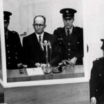 Criminal Adolf Eichmann, one of the main architects of the Holocaust, stands trial in Jerusalem in 1961. Seated in a bulletproof glass booth, he became the embodiment of Hannah Arendt’s controversial concept of the “banality of evil.”