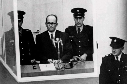Criminal Adolf Eichmann, one of the main architects of the Holocaust, stands trial in Jerusalem in 1961. Seated in a bulletproof glass booth, he became the embodiment of Hannah Arendt’s controversial concept of the “banality of evil.”
