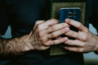 Holding faith and code: a visual metaphor of technology's rise as a modern belief system.