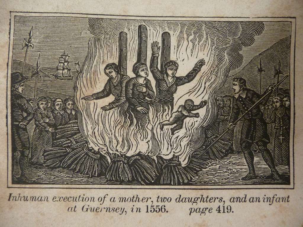 Persecution and execution of Mother Catherine Cauchés (center) and her two daughters, Guillemine Gilbert (left) and Perotine Massey (right), with her infant son. Engraving from Foxe’s Book of Martyrs (1563).