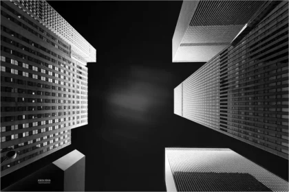 Political order: Skyscrapers converge against a stark black sky in Manhattan, capturing the scale and symmetry of New York City’s urban order.