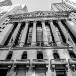 Facade of the New York Stock Exchange—an enduring symbol of corporate power and economic influence, central to the legal double standards explored in Dual Justice.