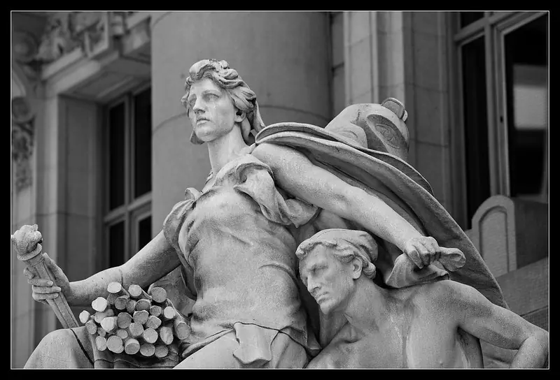 A symbolic figure of commerce and authority stands above the entrance to the Alexander Hamilton U.S. Custom House, which today houses both the National Museum of the American Indian and the U.S. Bankruptcy Court for the Southern District of New York. In bankruptcy, as in sculpture, strength often overshadows vulnerability.Photo by R.W. Sinclair, licensed under CC BY-NC-SA 2.0.