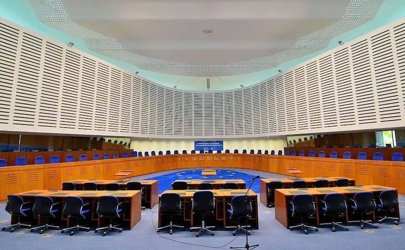 Courtroom of the European Court of Human Rights in Strasbourg. A discursive arena where legal language, multilingual procedure, and judicial reasoning coalesce into supranational justice.