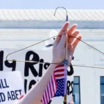 A coat hanger, symbol of unsafe abortion, held during a reproductive rights protest in Washington, D.C.