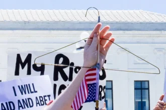 A coat hanger, symbol of unsafe abortion, held during a reproductive rights protest in Washington, D.C.