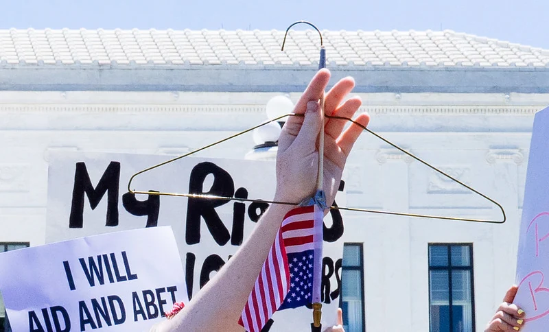 A coat hanger, symbol of unsafe abortion, held during a reproductive rights protest in Washington, D.C.