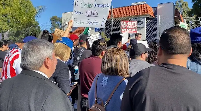 Protesters gather outside a detention site in Los Angeles, denouncing mass deportations and calling for immigration reform. (C00)