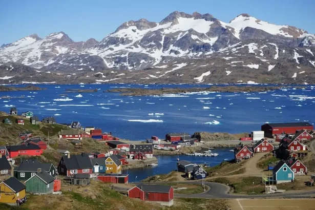 A coastal village in Greenland, where traditional Inuit life meets growing geopolitical interest and the visible effects of Arctic climate change.
