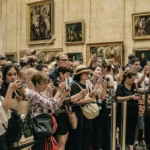 Tourists from around the world at the Louvre, a symbol of cultural soft power and global exchange. Photo by Alicia Steels.