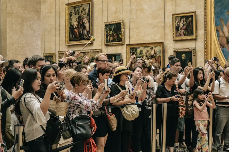 Tourists from around the world at the Louvre, a symbol of cultural soft power and global exchange. Photo by Alicia Steels.