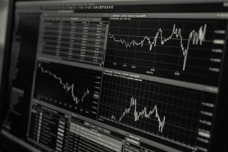 Stock market trading screen displaying real-time financial data and market charts, illustrating price fluctuations and trading activity. (C00)