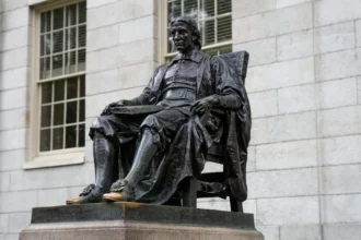 Statue at Harvard Yard, a recognizable landmark of the university’s historic campus.
