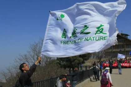 Members of civil society rally under the banner of Friends of Nature, one of China’s pioneering environmental NGOs, promoting awareness and action for ecological protection.