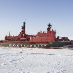 A Russian nuclear-powered icebreaker navigates Arctic sea ice, enabling year-round access to the Northern Sea Route and reinforcing the strategic and economic reach of emerging Tri-Axis connectivity.