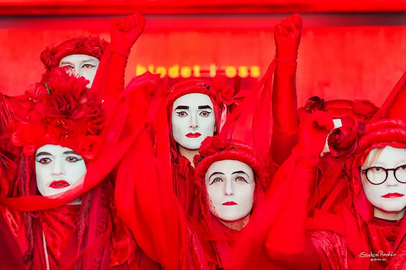 Members of Extinction Rebellion's Red Rebel Brigade at a demonstration. Photo by Stefan Roudén (CC BY-NC-SA 4.0)
