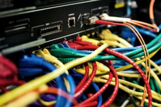 AI Backlash: Behind the promise of AI is a tangle of cables, servers and power lines, and a growing public demand to decide how they are built. Photo: Bob Mical (CC BY 3.0 US)