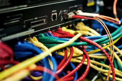 AI Backlash: Behind the promise of AI is a tangle of cables, servers and power lines, and a growing public demand to decide how they are built. Photo: Bob Mical (CC BY 3.0 US)
