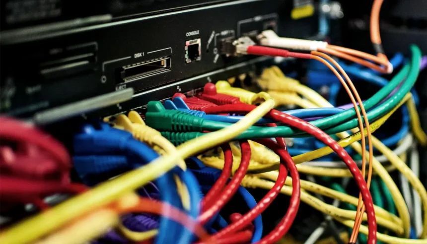 AI Backlash: Behind the promise of AI is a tangle of cables, servers and power lines, and a growing public demand to decide how they are built. Photo: Bob Mical (CC BY 3.0 US)