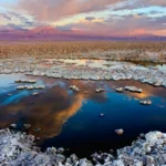 Critical minerals: the Salar de Atacama salt flat in Chile at sunset, with volcanoes on the horizon